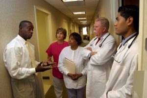 Doctors and nurses meeting in hallway